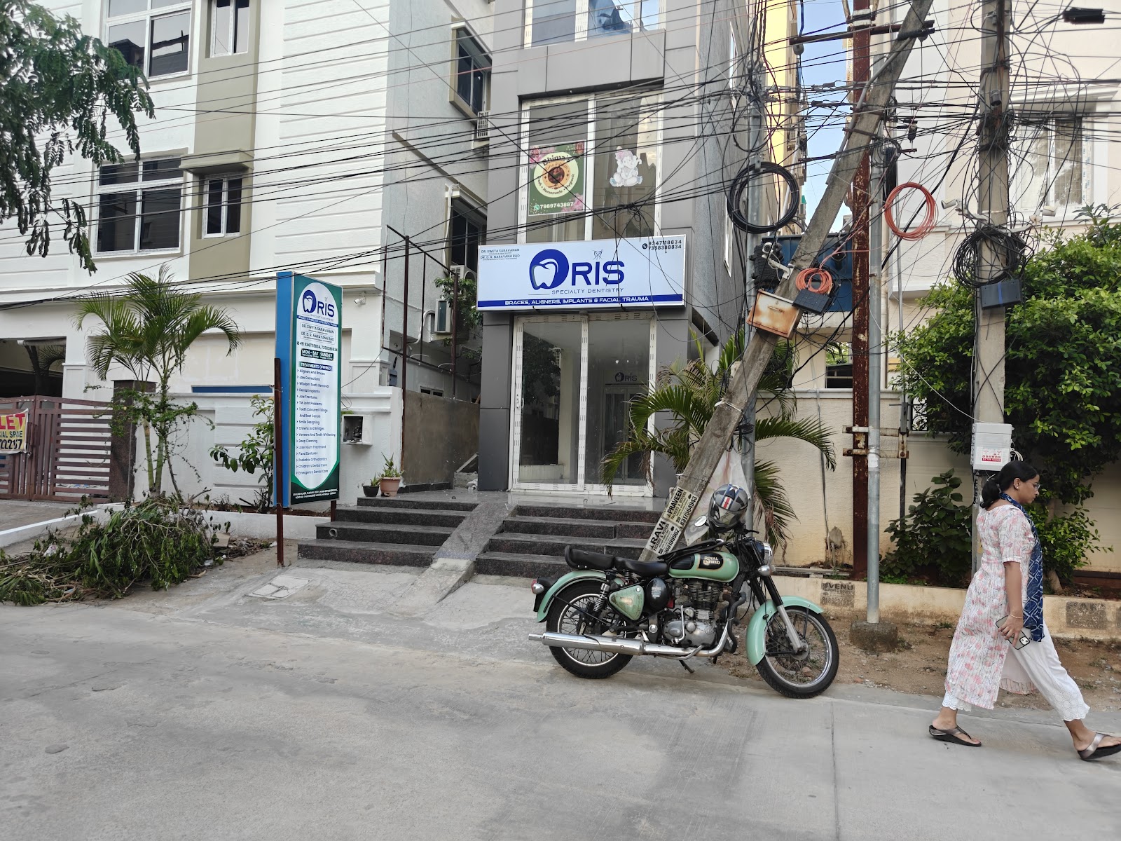 Real exterior building facade and signage of ORIS Speciality Dentistry on Road No. 1, Mathrusree Nagar, Miyapur